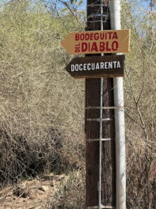 street sign pointing to Docecuarenta coffee shop in Todos Santos Baja Sur
